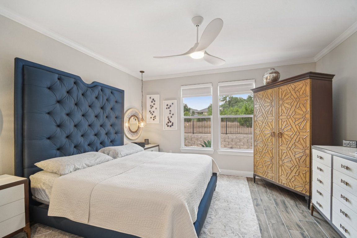 309 Kitty Hawk Road Georgetown, TX 78633 - Photo 20 of 37 a bedroom with a large bed and a window