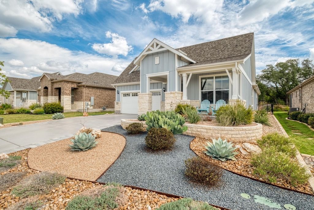 309 Kitty Hawk Road Georgetown, TX 78633 - Photo 2 of 37 a front view of a house with a yard