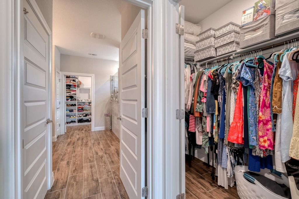 309 Kitty Hawk Road Georgetown, TX 78633 - Photo 25 of 37 a view of walk in closet with clothes and shoes