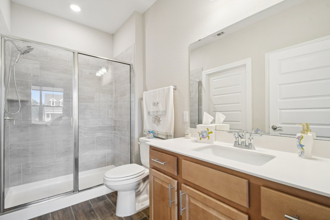 309 Kitty Hawk Road Georgetown, TX 78633 - Photo 28 of 37 a bathroom with a sink a toilet and shower