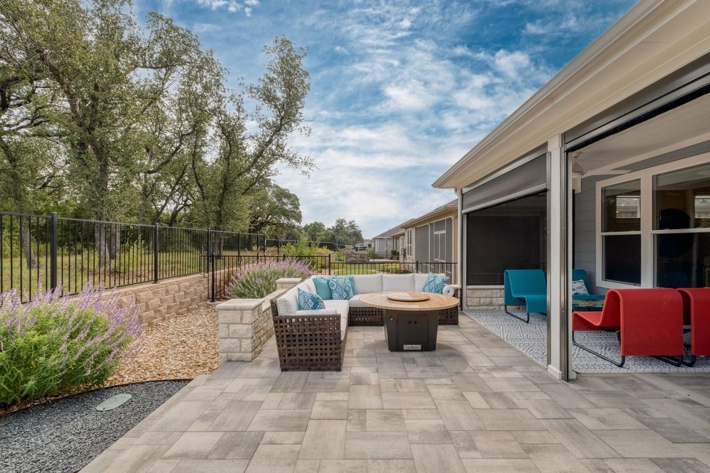 309 Kitty Hawk Road Georgetown, TX 78633 - Photo 36 of 37 a view of a patio with couches and a table and chairs with wooden fence
