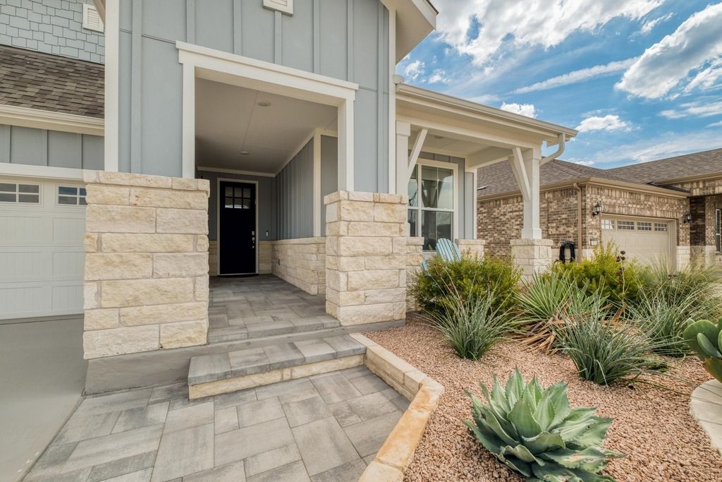 309 Kitty Hawk Road Georgetown, TX 78633 - Photo 4 of 37 a view of a pathway with potted plants