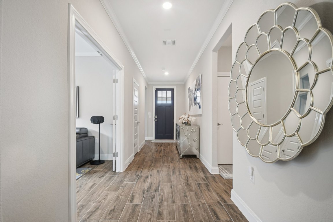 309 Kitty Hawk Road Georgetown, TX 78633 - Photo 6 of 37 a view of a livingroom with wooden floor and a large window