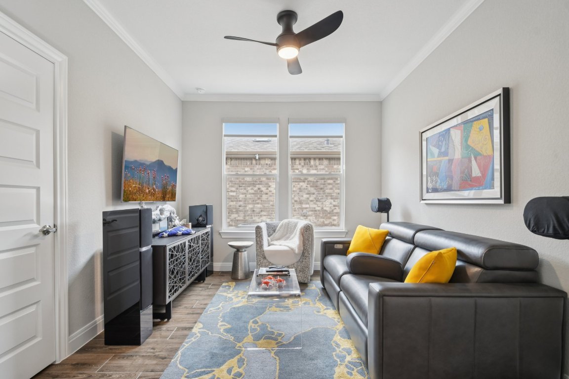 309 Kitty Hawk Road Georgetown, TX 78633 - Photo 8 of 37 a living room with furniture and a flat screen tv