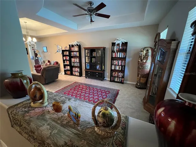 a bedroom with a large bed and a wooden floor