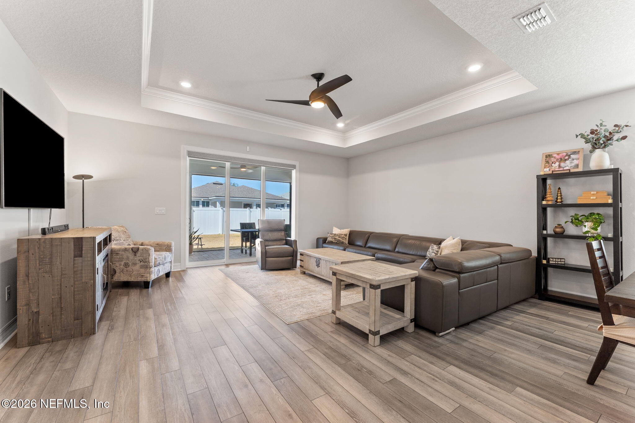 345 Muhly Grass Street Yulee, FL 32097 - Photo 13 of 42 a living room with furniture and a flat screen tv