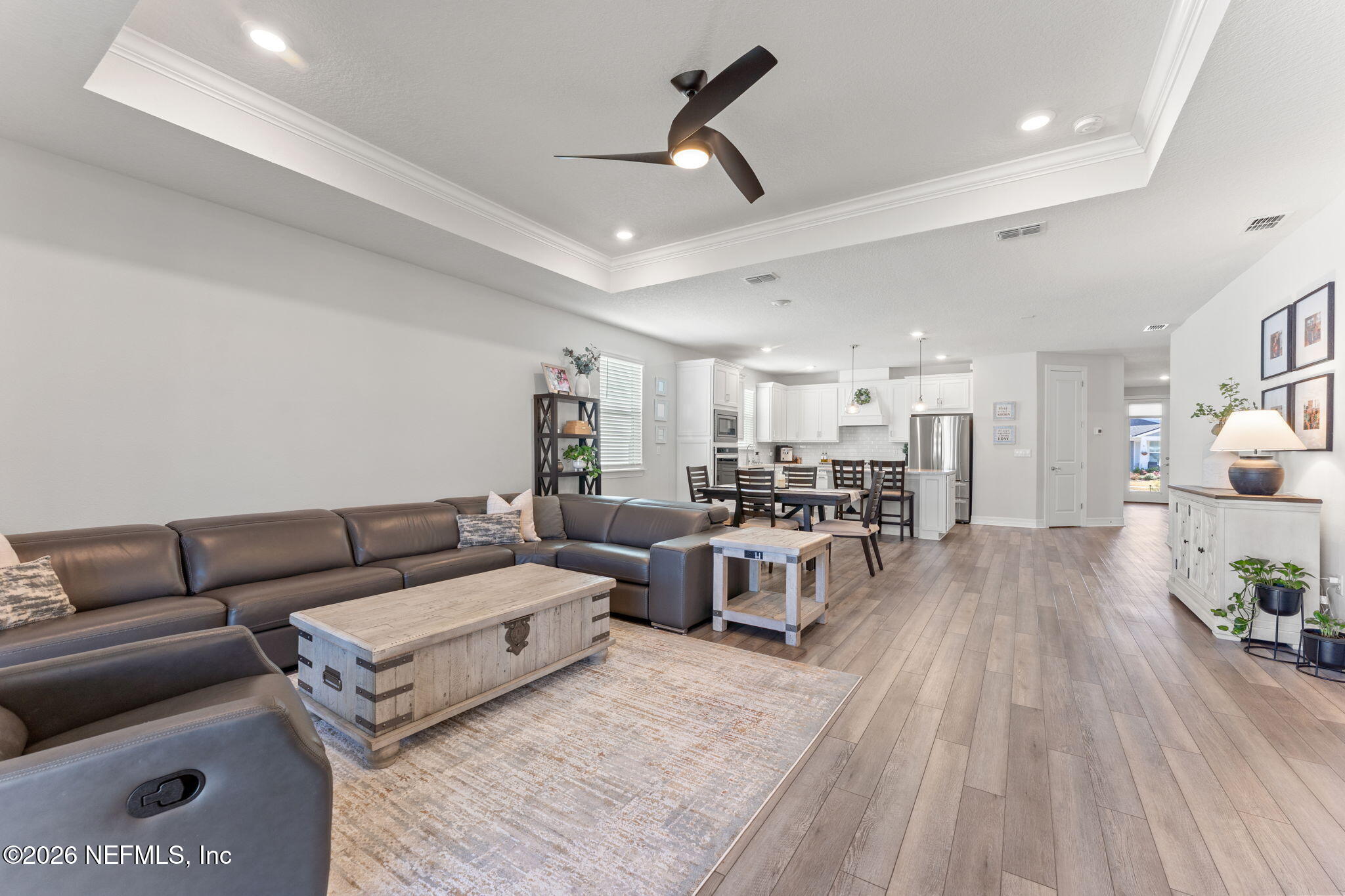 345 Muhly Grass Street Yulee, FL 32097 - Photo 15 of 42 a living room with furniture and a wooden floor