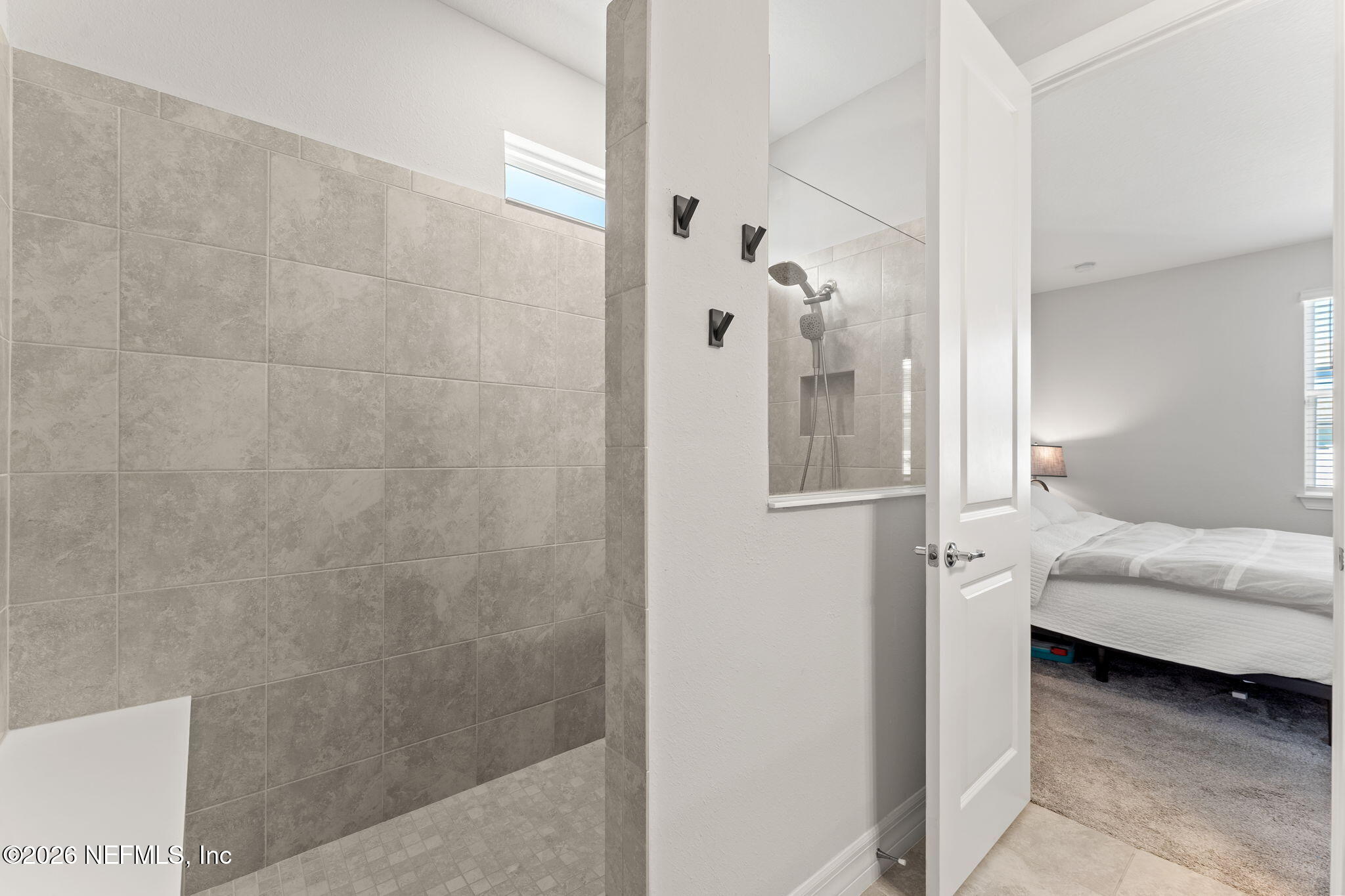 345 Muhly Grass Street Yulee, FL 32097 - Photo 18 of 42 a bathroom with a bathtub and a shower
