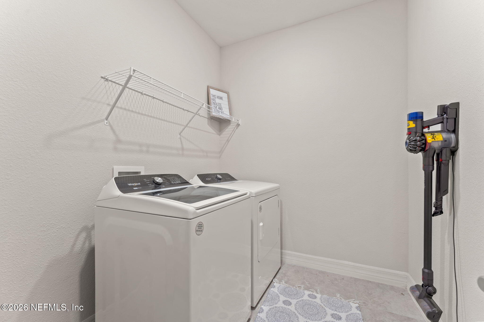 345 Muhly Grass Street Yulee, FL 32097 - Photo 25 of 42 a utility room with dryer and washer