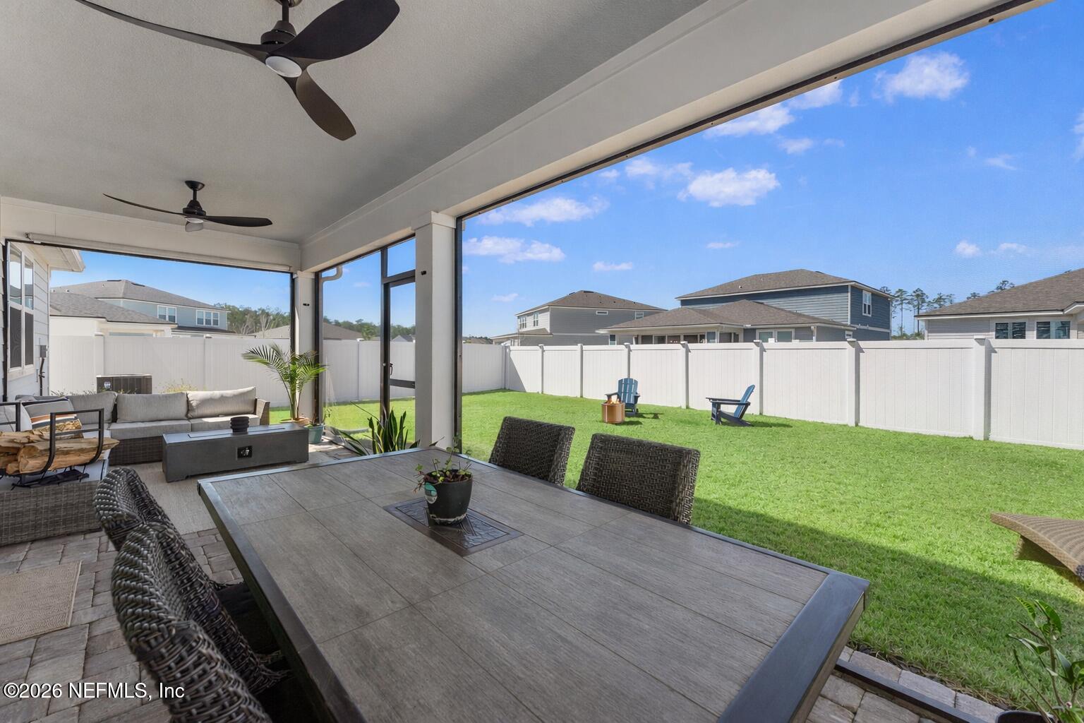 345 Muhly Grass Street Yulee, FL 32097 - Photo 27 of 42 a view of a dining room with furniture window and outside view