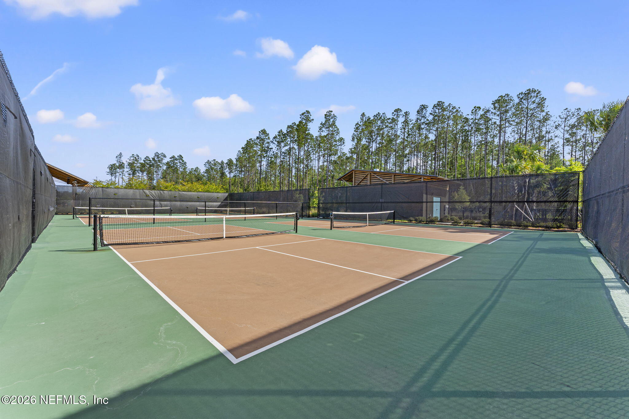 345 Muhly Grass Street Yulee, FL 32097 - Photo 36 of 42 a view of a tennis court