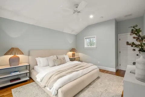 a bedroom with a bed and a couch