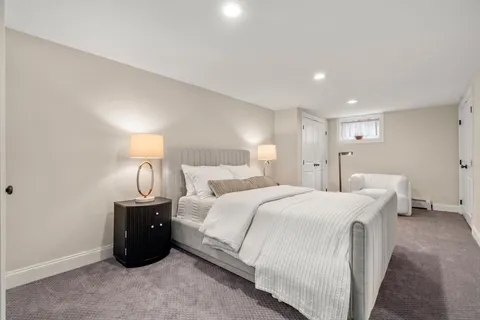 a bed room with a bed and a night stand