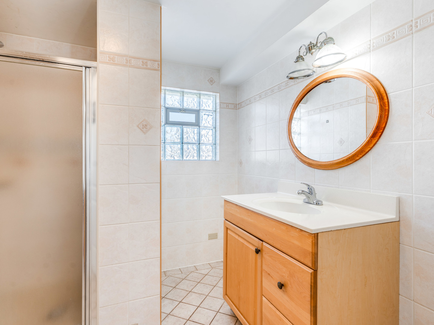 25216 River Road Lake Barrington, IL 60010 - Photo 12 of 36 a bathroom with a sink a vanity and a mirror