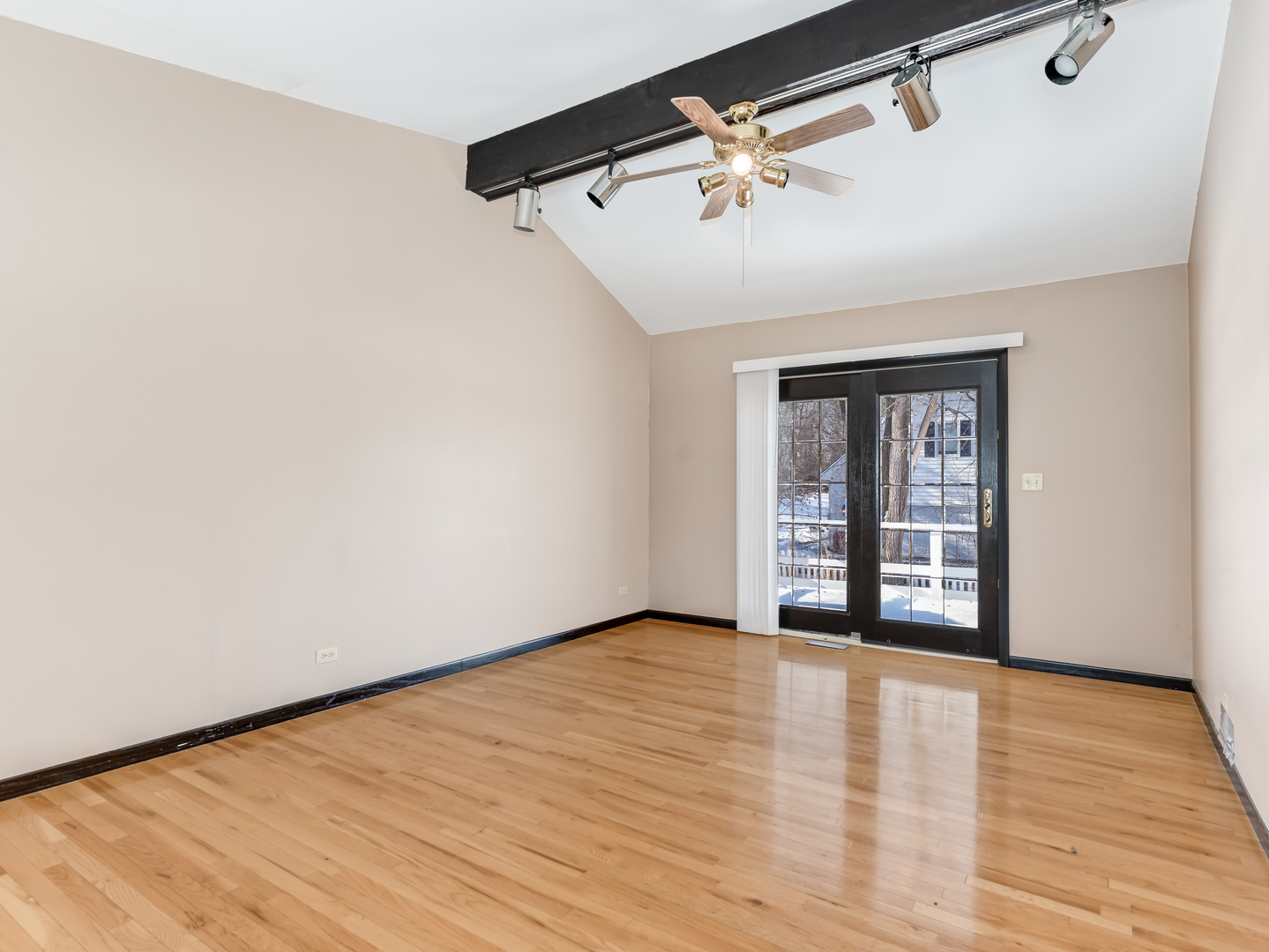 25216 River Road Lake Barrington, IL 60010 - Photo 13 of 36 a view of an empty room with wooden floor and a window