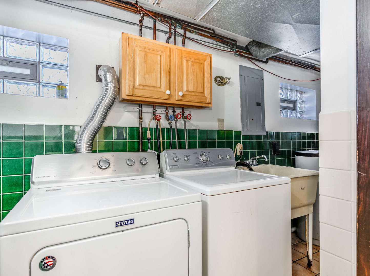 25216 River Road Lake Barrington, IL 60010 - Photo 22 of 36 a view of washer and dryer with bathroom in the background
