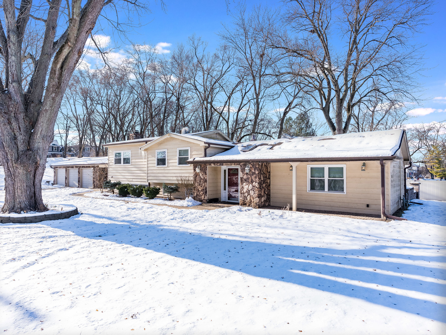 25216 River Road Lake Barrington, IL 60010 - Photo 24 of 36 a front view of a house with a yard covered in snow