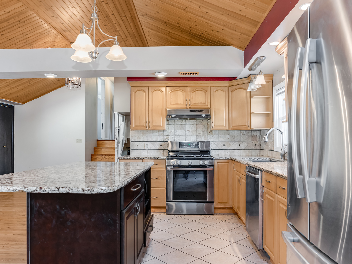 25216 River Road Lake Barrington, IL 60010 - Photo 8 of 36 a kitchen with stainless steel appliances granite countertop a sink stove and refrigerator