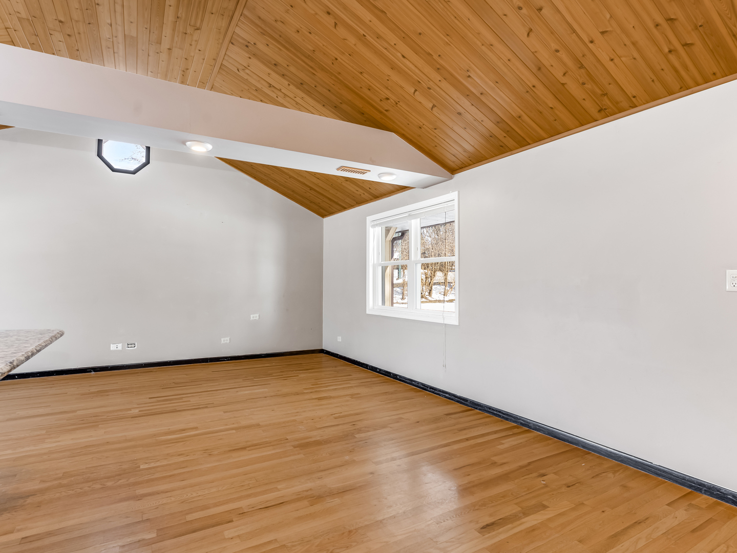 25216 River Road Lake Barrington, IL 60010 - Photo 10 of 36 a view of an empty room with wooden floor and a window