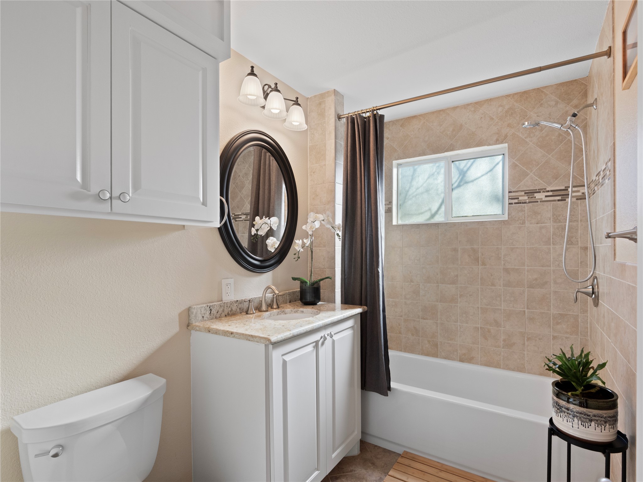 5108 Sioux Lane Austin, TX 78734 - Photo 15 of 35 a bathroom with a sink a toilet and a bathtub