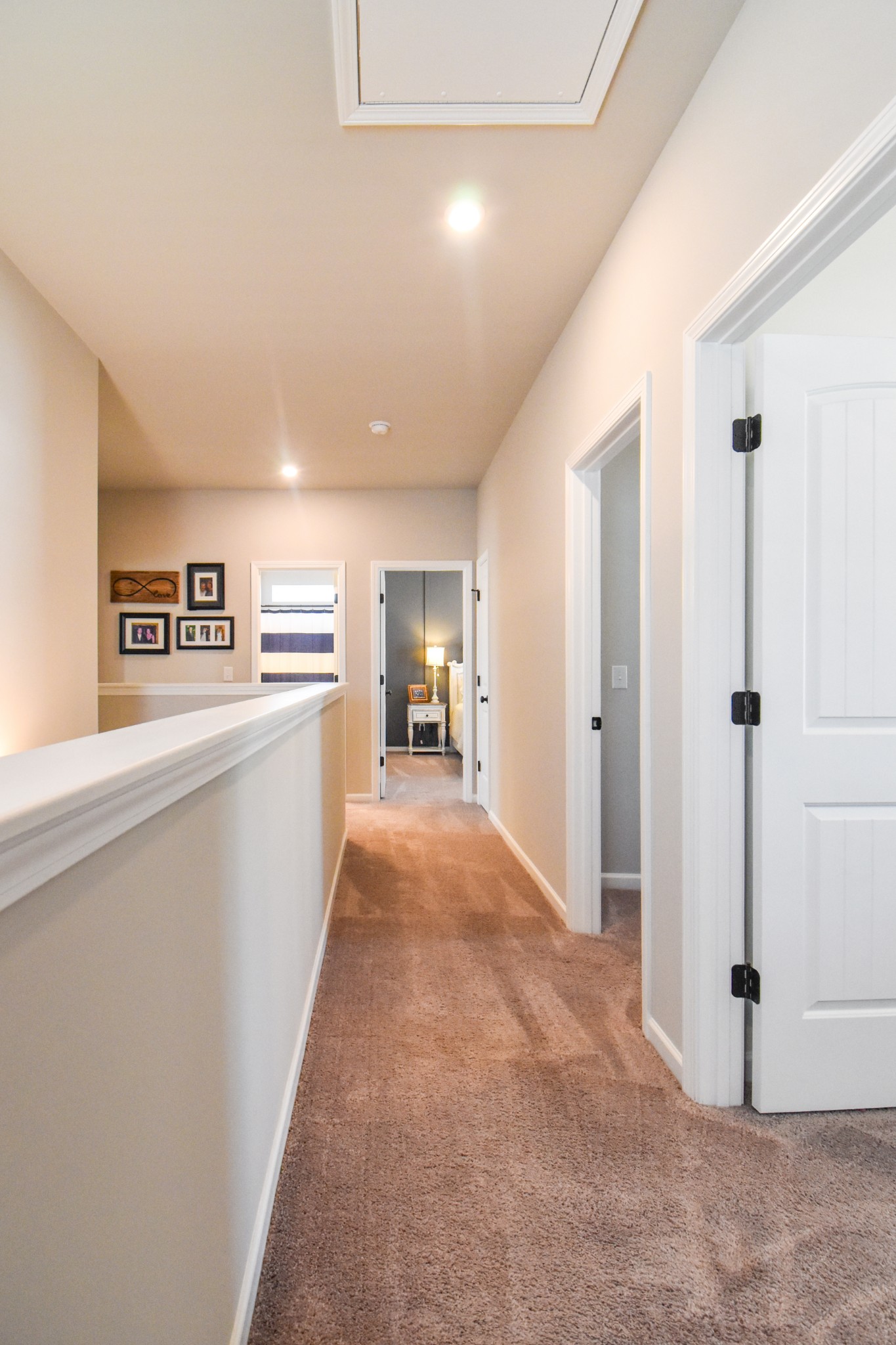 2991 Timewinder Way Columbia, TN 38401 - Photo 18 of 29 a view of a hallway with wooden floor and a living room