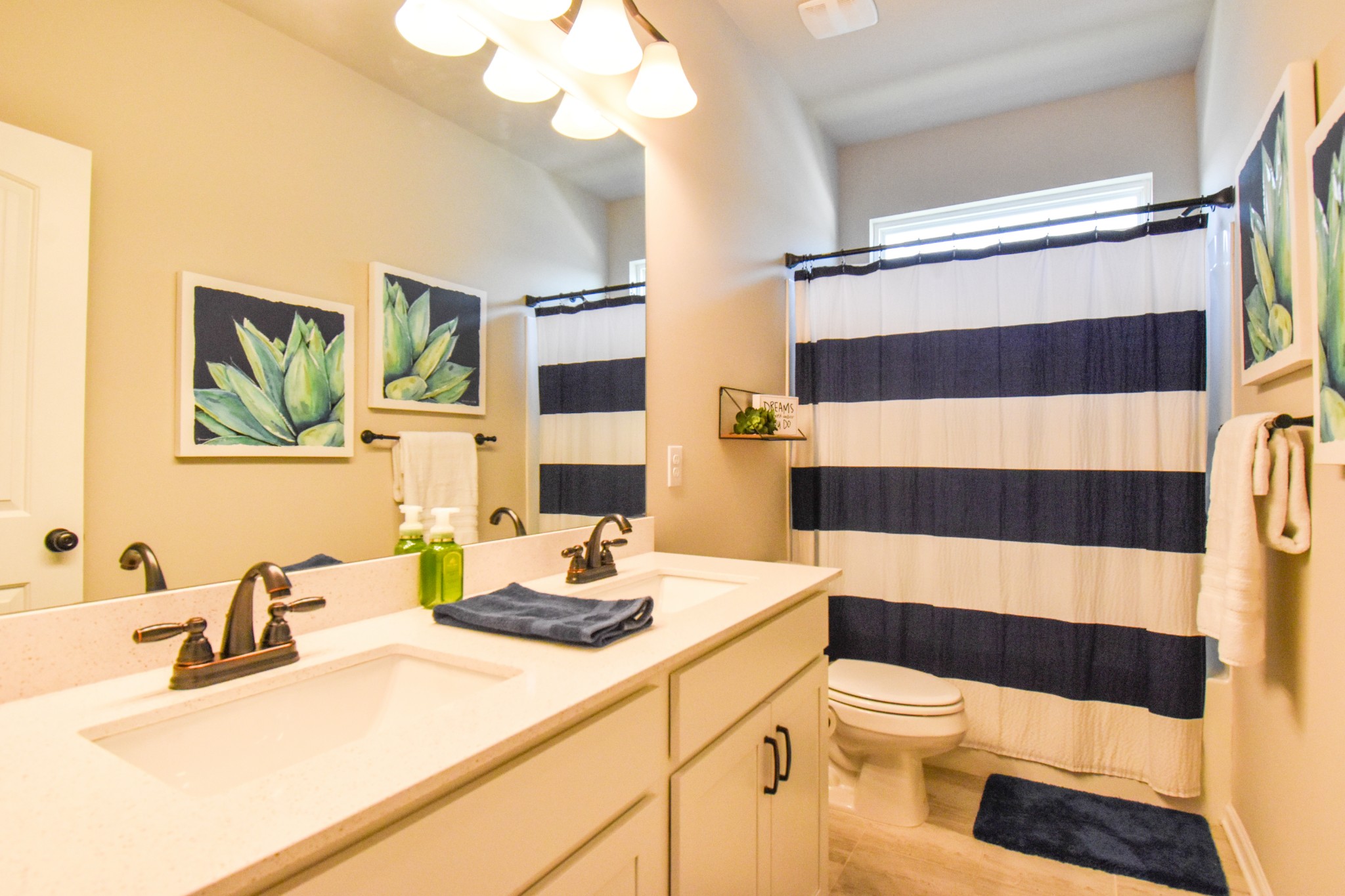 2991 Timewinder Way Columbia, TN 38401 - Photo 20 of 29 a bathroom with a sink a toilet a shower curtain and a mirror