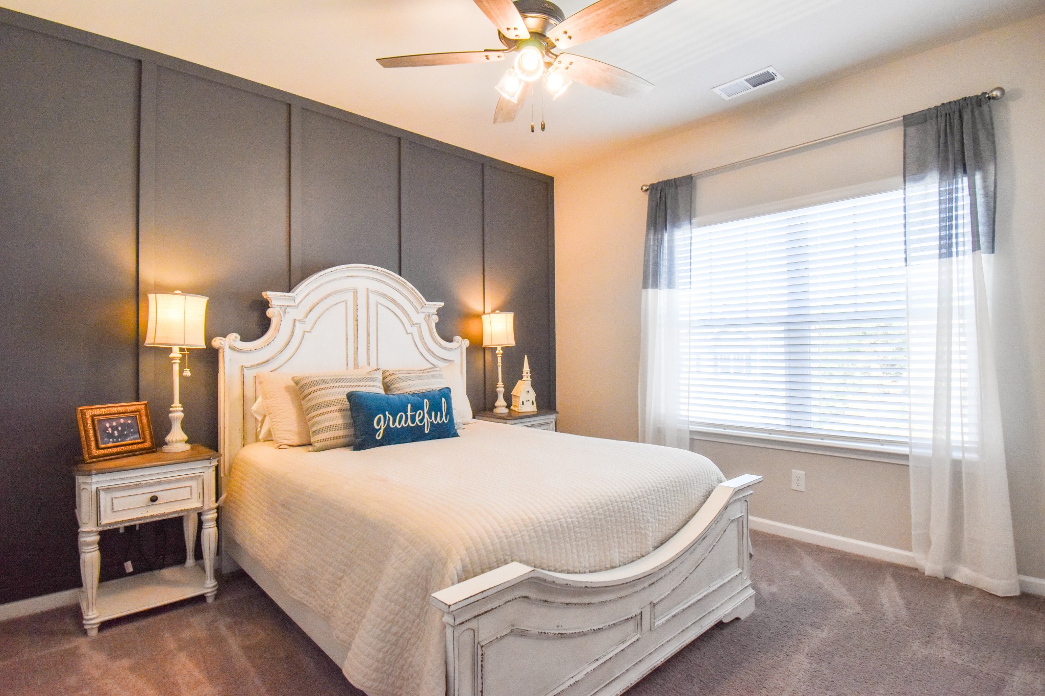 2991 Timewinder Way Columbia, TN 38401 - Photo 21 of 29 a bedroom with a bed and a chandelier