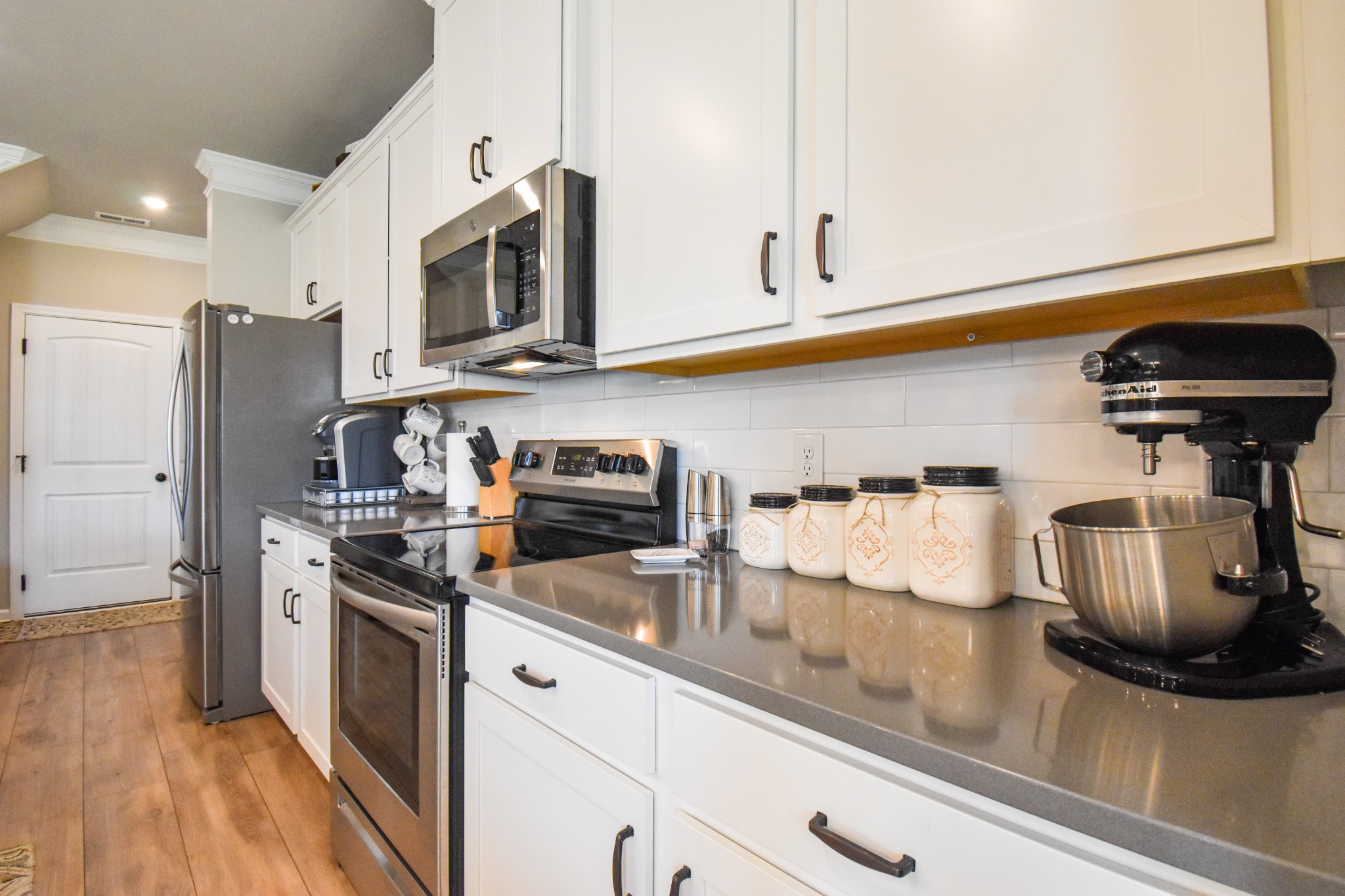 2991 Timewinder Way Columbia, TN 38401 - Photo 8 of 29 a kitchen with stainless steel appliances granite countertop a refrigerator a stove and a sink