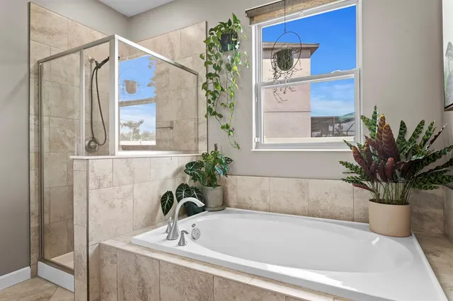 a bathroom with a bathtub and a sink