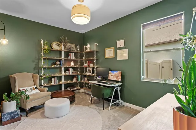 a view of a workspace with furniture