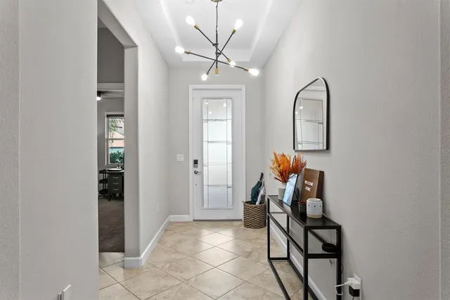 a view of a livingroom with furniture and a chandelier