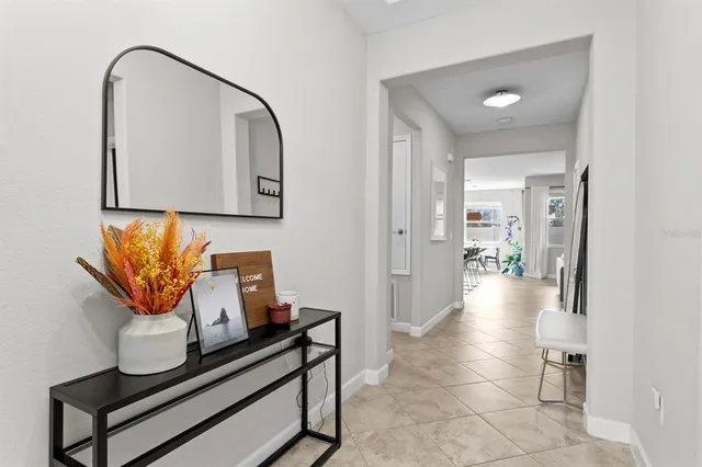 a view of a hallway with seating area