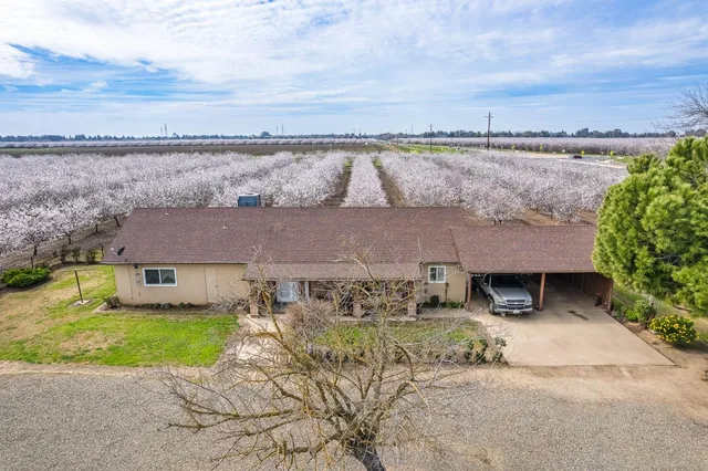 an aerial view of a house with a garden