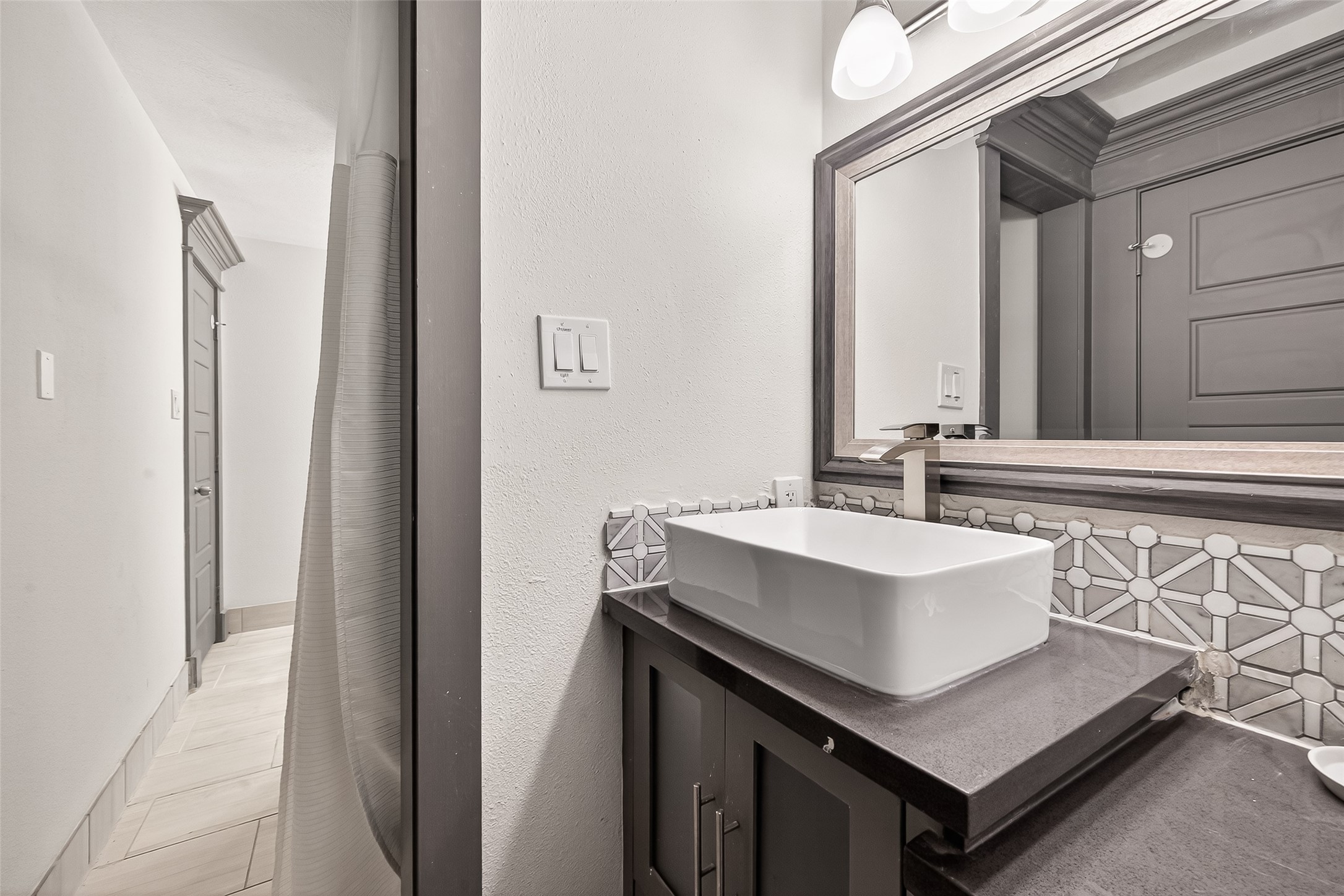 3684 Ocee Street Houston, TX 77063 - Photo 20 of 32 a bathroom with a sink and a mirror