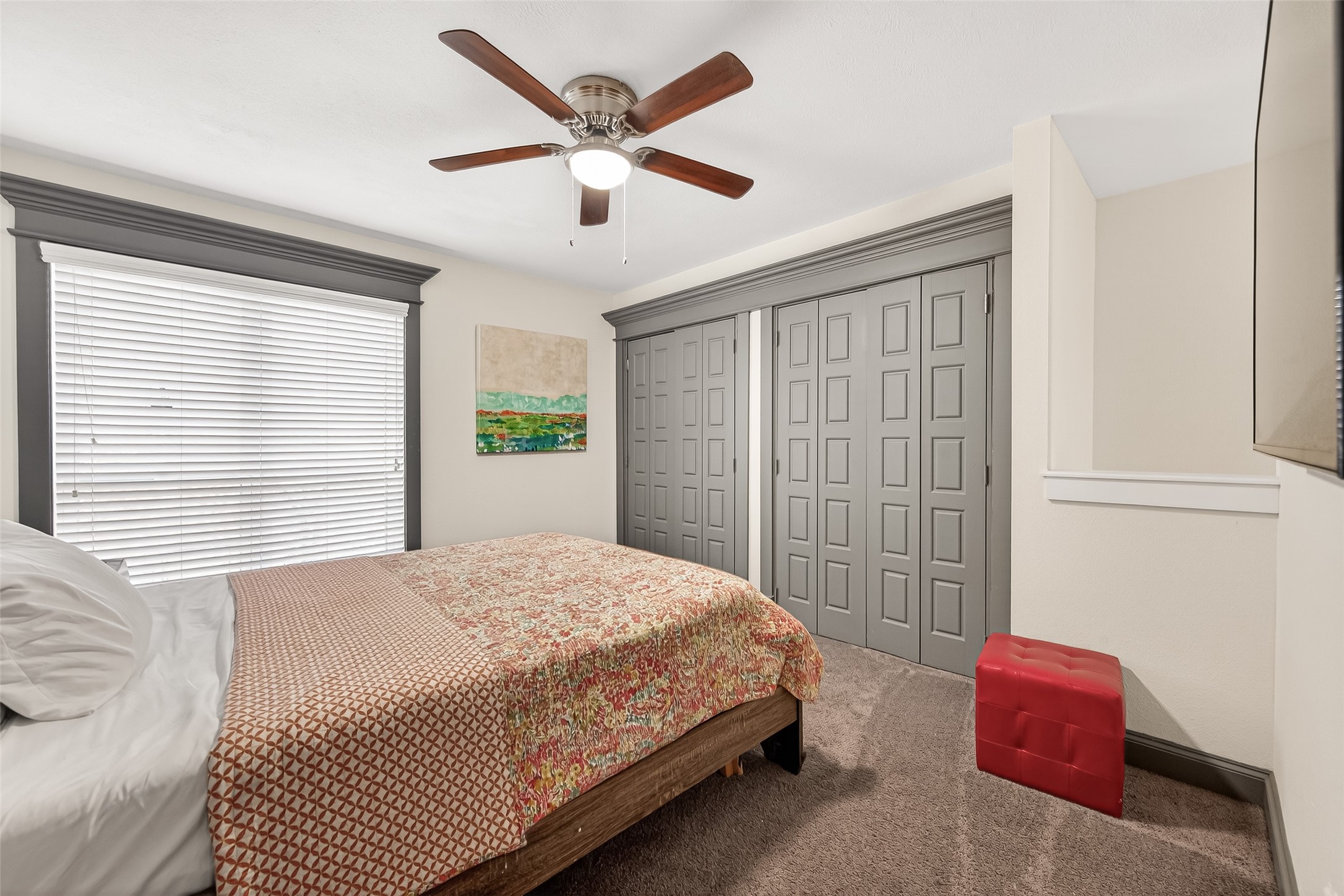 3684 Ocee Street Houston, TX 77063 - Photo 21 of 32 a bedroom with a large bed and a chandelier