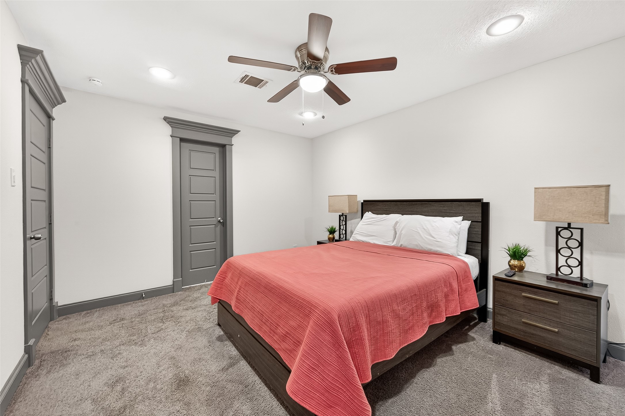 3684 Ocee Street Houston, TX 77063 - Photo 24 of 32 a bedroom with a bed and a ceiling fan