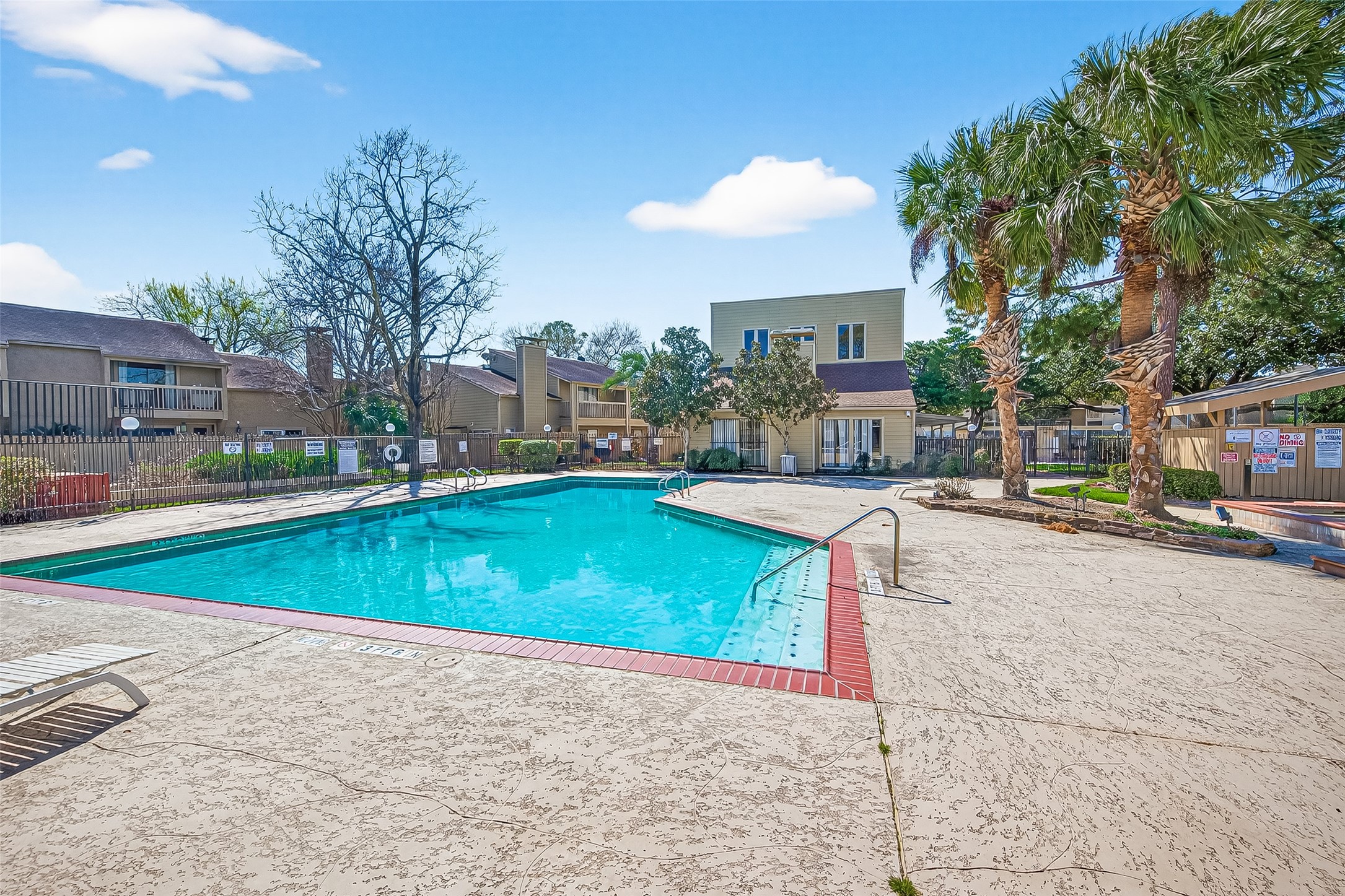 3684 Ocee Street Houston, TX 77063 - Photo 31 of 32 a view of a swimming pool with a lounge chairs