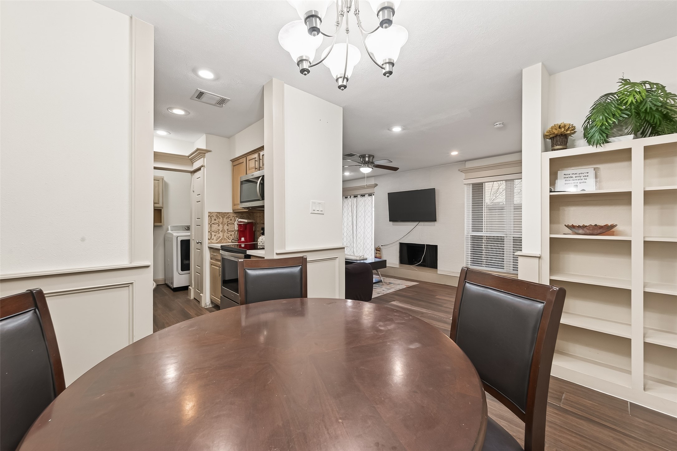 3684 Ocee Street Houston, TX 77063 - Photo 7 of 32 a view of a dining room with furniture window and wooden floor