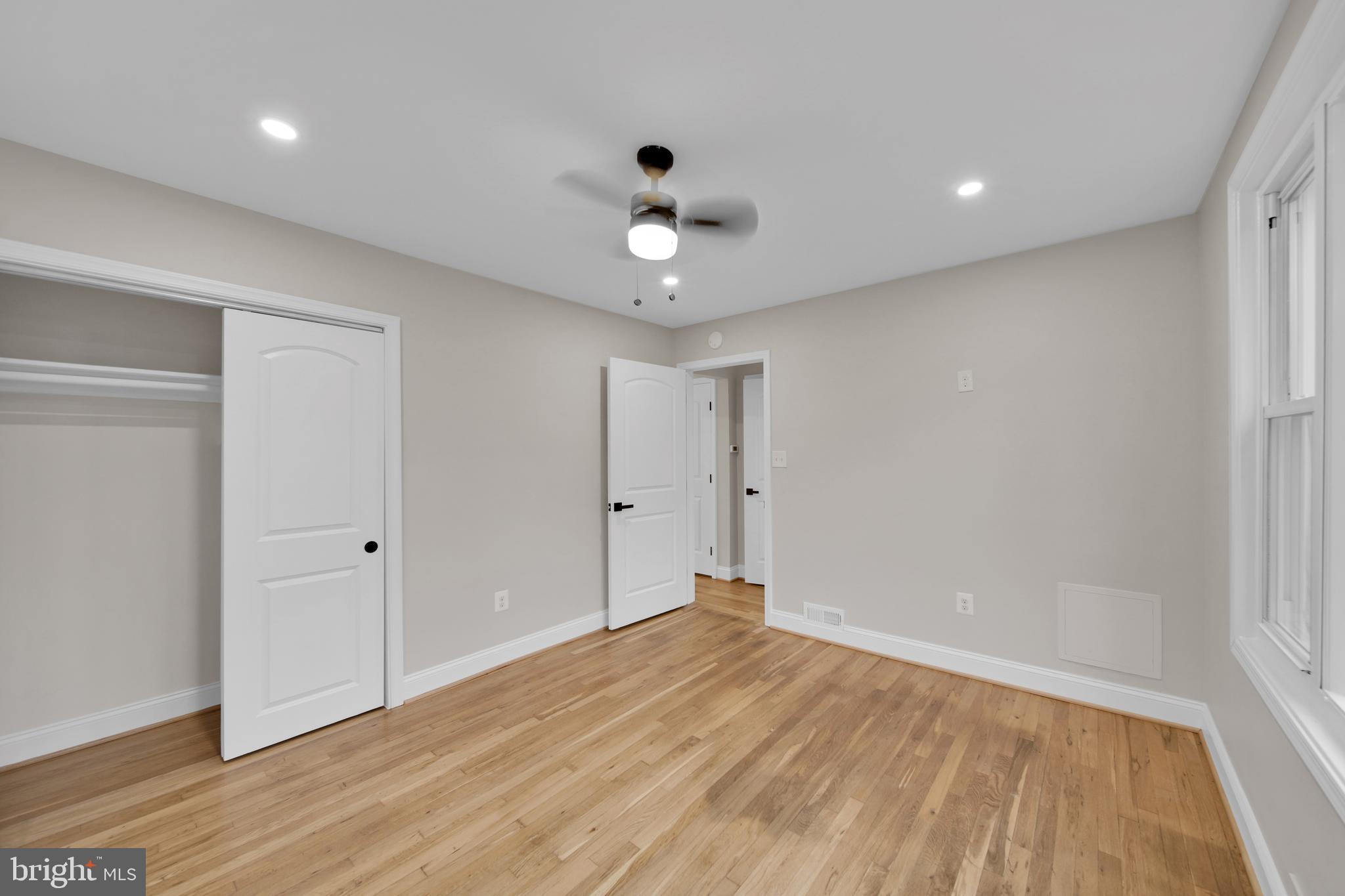 119 Victor Street Northeast, Unit 2 Washington, DC 20011 - Photo 12 of 25 wooden floor in an empty room with a window