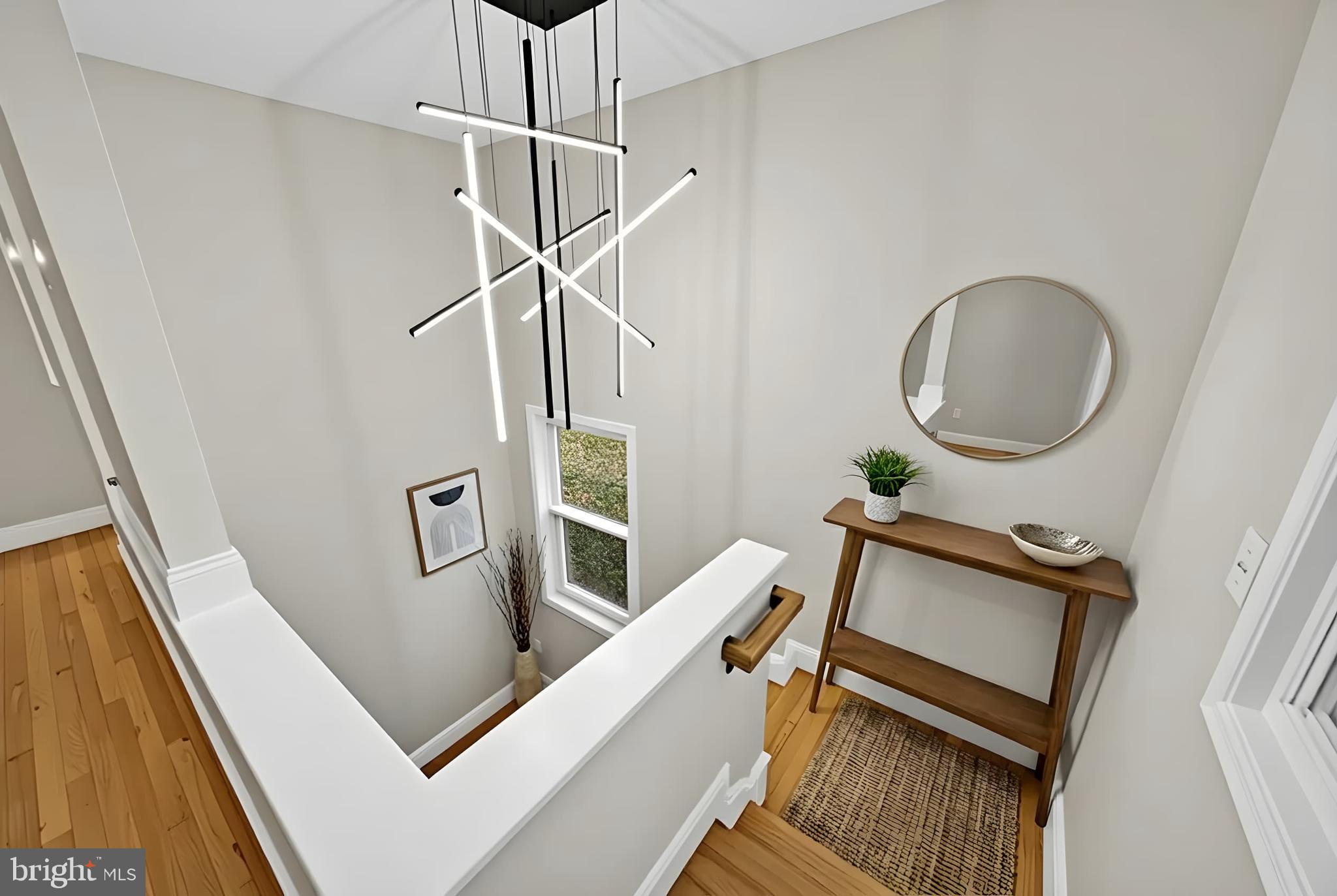 119 Victor Street Northeast, Unit 2 Washington, DC 20011 - Photo 16 of 25 a view of a room with wooden floor and windows