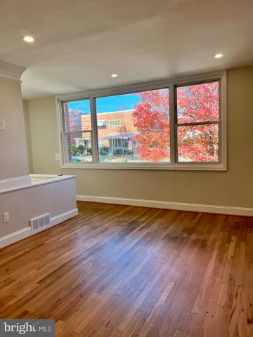 a kitchen with kitchen island granite countertop a stove and a sink