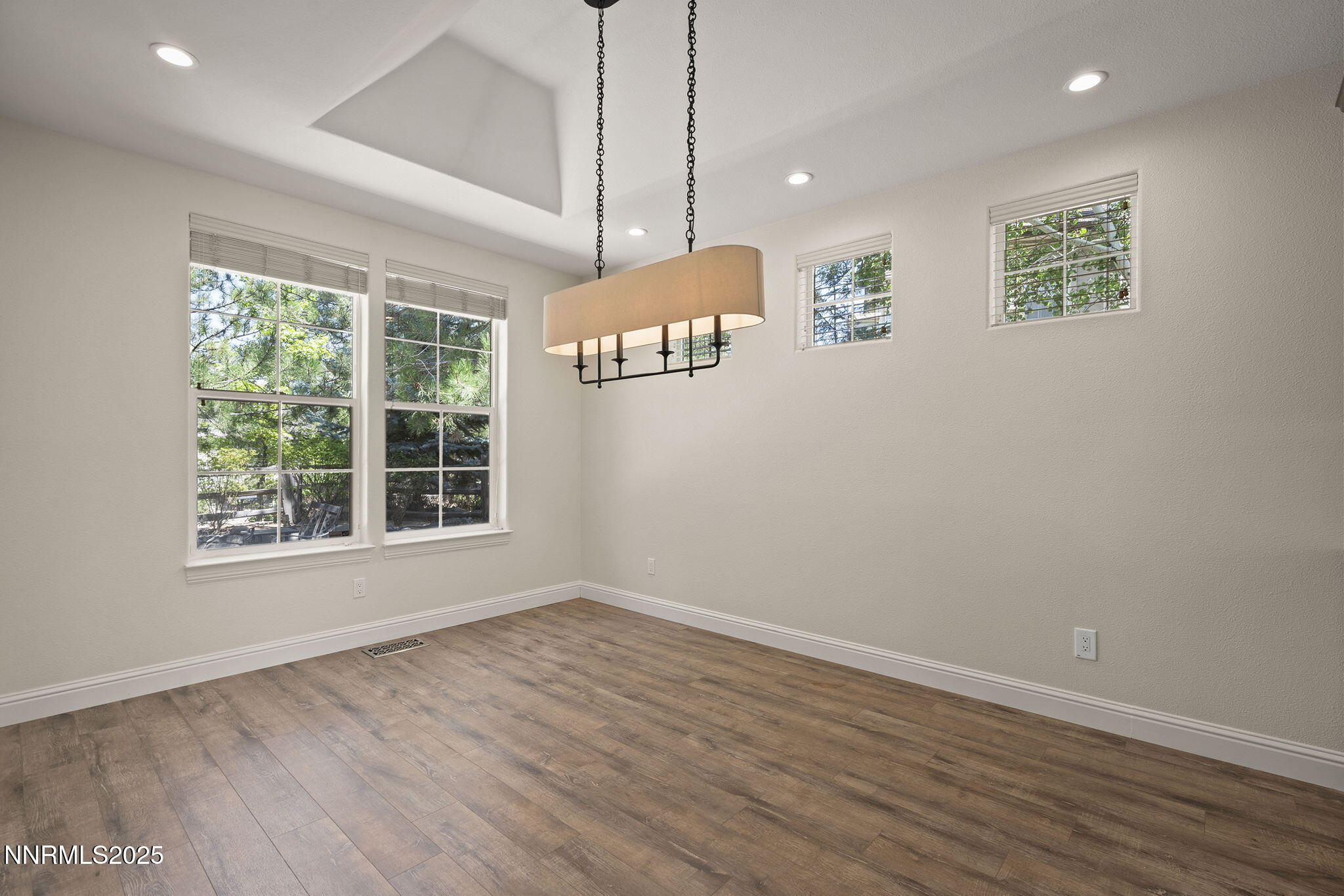 4885 Buckhaven Road Reno, NV 89519 - Photo 12 of 54 an empty room with windows and ceiling fan