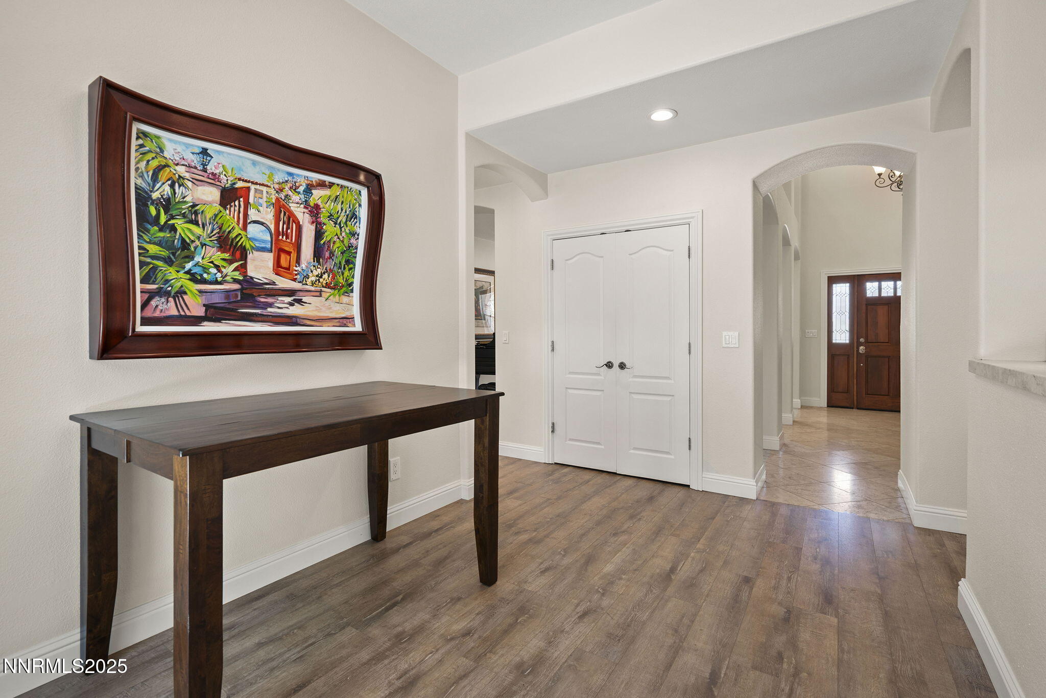4885 Buckhaven Road Reno, NV 89519 - Photo 14 of 54 a view of a hallway with wooden floor and furniture