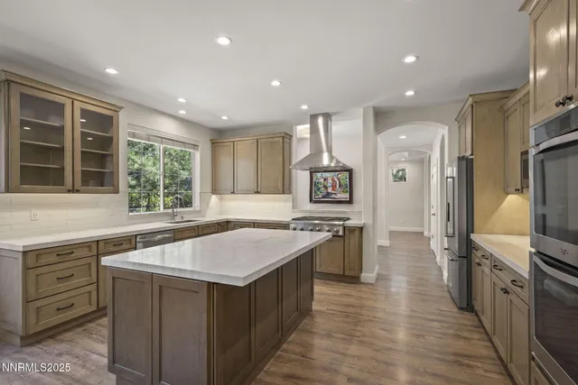 a kitchen with a stove a sink and a refrigerator