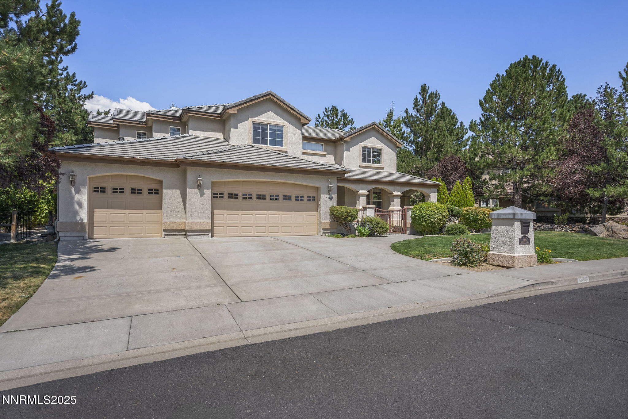 4885 Buckhaven Road Reno, NV 89519 - Photo 2 of 54 a view of house with outdoor space and parking