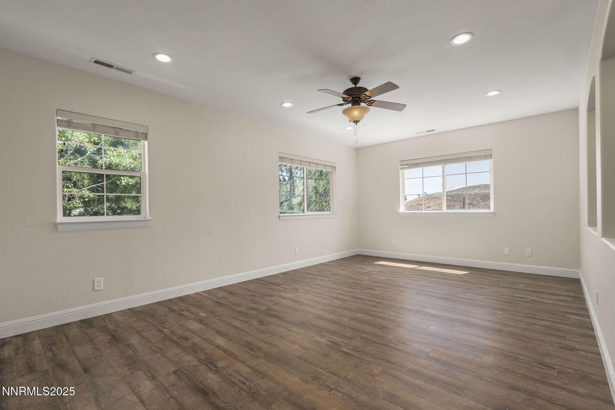 4885 Buckhaven Road Reno, NV 89519 - Photo 29 of 54 a view of an empty room with a window and wooden floor