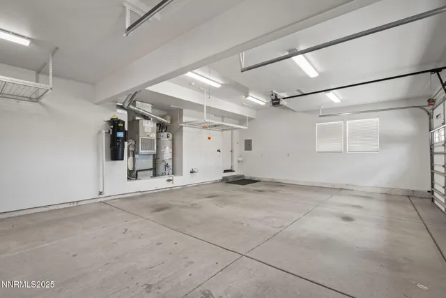 a view of a backyard with sitting area and garden