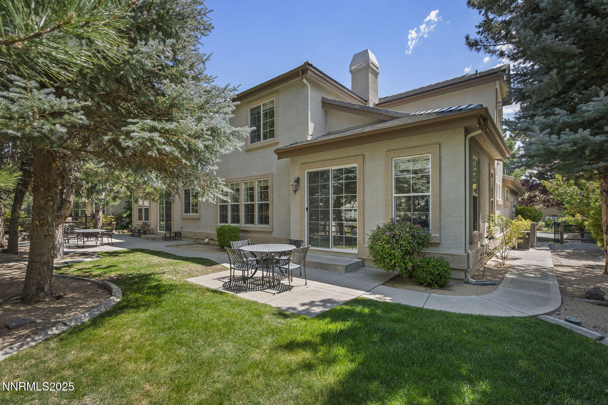 4885 Buckhaven Road Reno, NV 89519 - Photo 42 of 54 a front view of a house with patio and garden