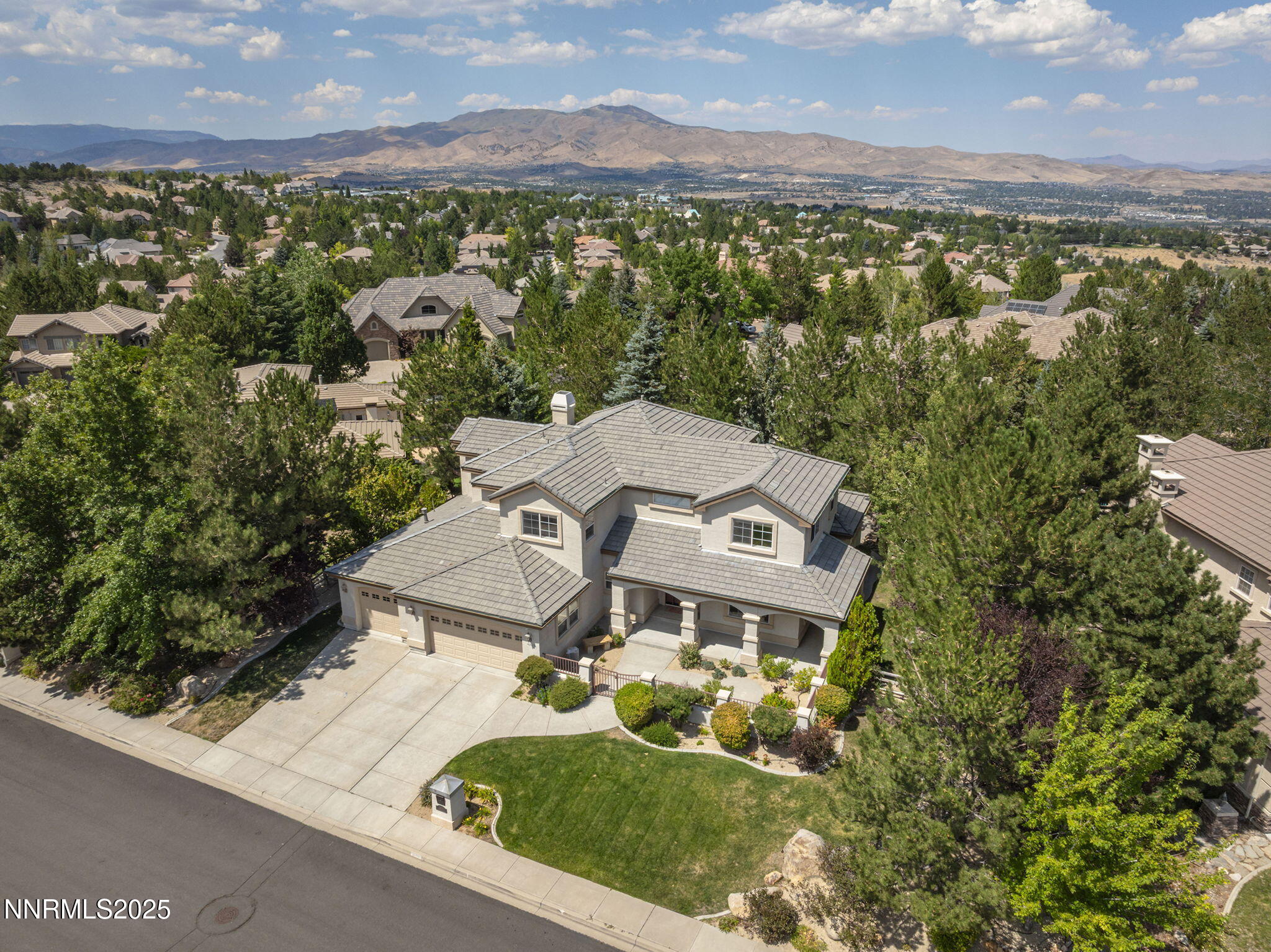 4885 Buckhaven Road Reno, NV 89519 - Photo 45 of 54 an aerial view of residential house with outdoor space and mountain view in back