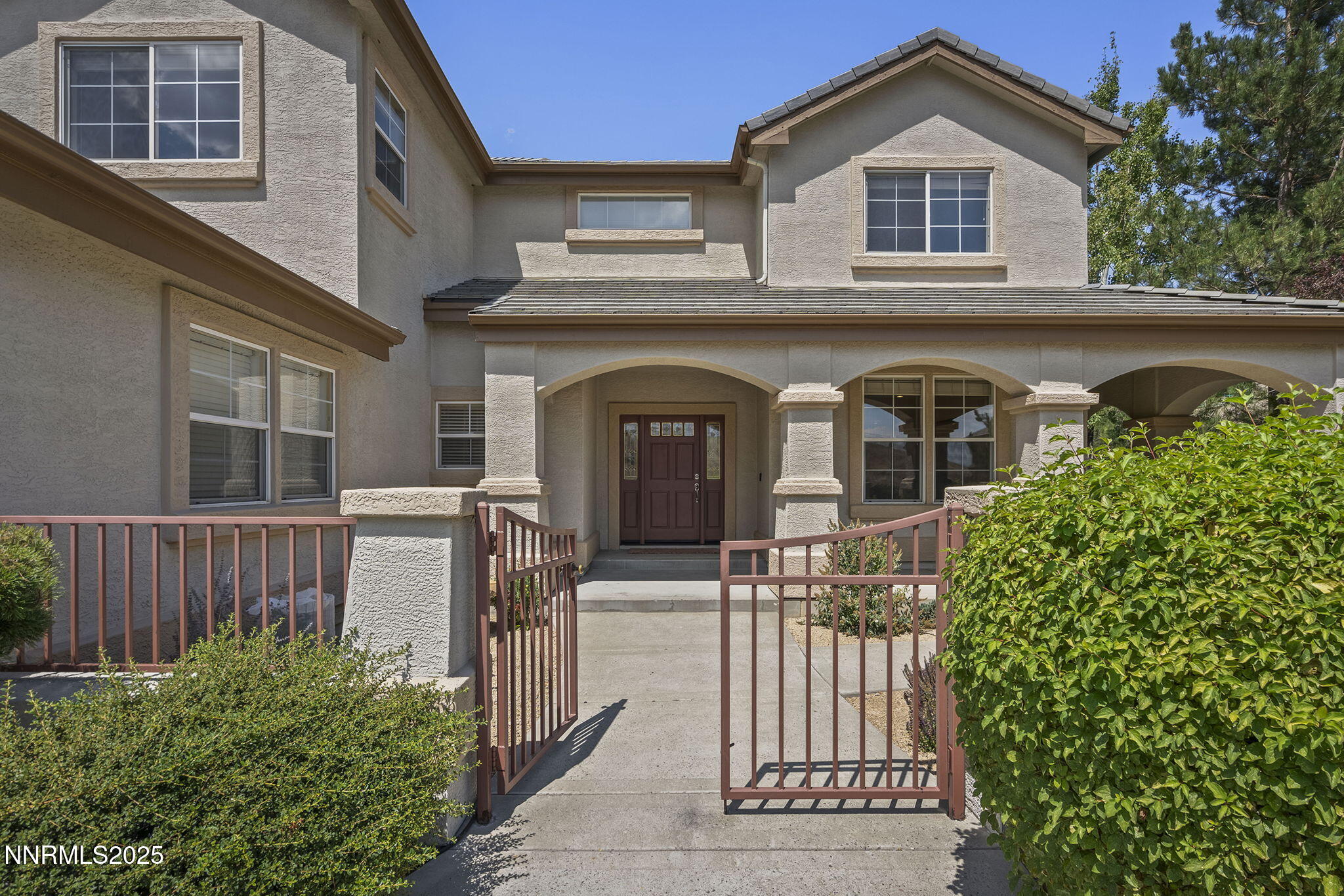 4885 Buckhaven Road Reno, NV 89519 - Photo 6 of 54 a front view of a house with a garden